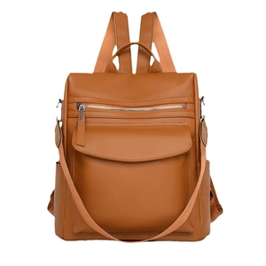 Caramel brown leather backpack with litchi grain texture and silver zipper detail