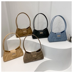 Collection of French-style faux suede underarm bags in five neutral colors on white stand