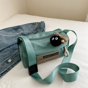 Teal Oxford fabric crossbody bag with wide strap and sports patch for outdoor leisure