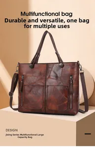 Vue détaillée du sac cabas marron vintage avec doubles poignées et poches zippées