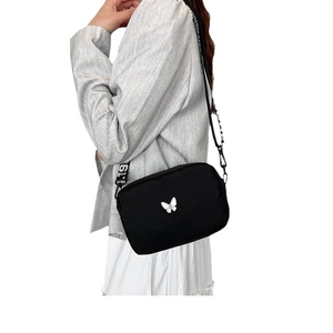 Chic black nylon crossbody bag with embroidered white butterfly and wide patterned strap