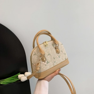 Fashionable straw shell crossbody bag with floral embroidery and brown leather trim