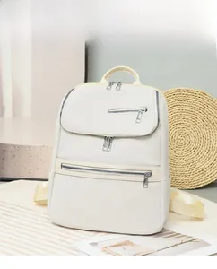 Detail of the multi-compartment beige nylon backpack with durable stylish straps