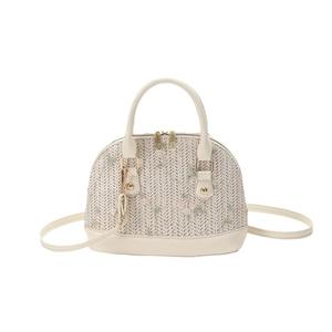 Straw shell crossbody bag with floral embroidery and white faux leather straps
