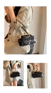 Detail of black sequin evening bag with gold ring handle and elegant chain strap
