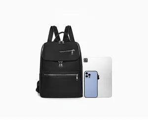 Detailed comparison of black nylon backpack capacity shown next to iPad Pro and phone