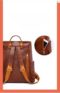 Detail view of brown vintage leather backpack featuring anti-theft back zipper pocket