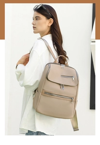 Side view of a khaki PU leather backpack featuring magnetic flap and silver zippers