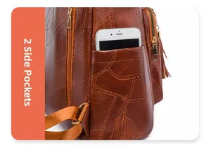 Detail of vintage brown backpack side pocket with phone storage and gold zipper tassel