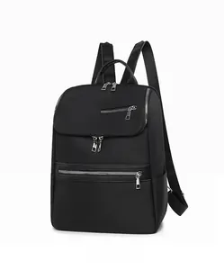 Side view of black oxford backpack showing multi-pocket design and leather top handle