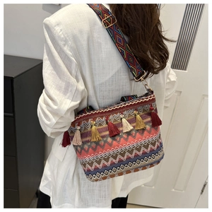 Bohemian woven bucket bag with tassels and colorful ethnic shoulder strap for women