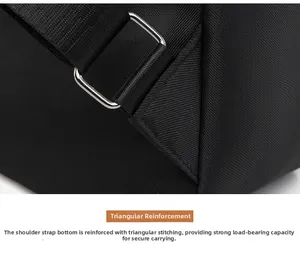 Detail of reinforced triangular stitching and metal adjustment buckle on black backpack strap
