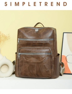 Detail view of brown PU leather backpack with vintage stitching and multiple zip pockets