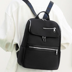 Large black Oxford cloth backpack for students featuring multi-zipper pockets and minimalist style