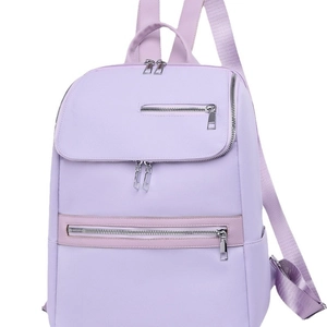 Light purple oxford fabric backpack with multiple zipper compartments for casual travel