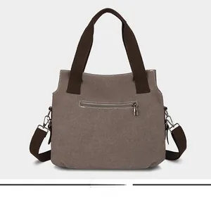 Vue arrière du sac cabas en toile avec poche zippée et bandoulières en textile