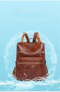 Detail showing the waterproof high-density PU leather material of the brown backpack