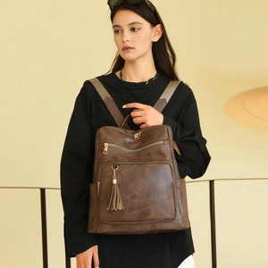 Retro brown leather backpack for women with geometric stitching and tassel detail