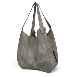 Close-up of vintage-style tote bag texture with logo patch and zipper detail