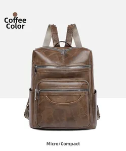 Detail view of coffee PU leather backpack showing crocodile texture and silver zippers