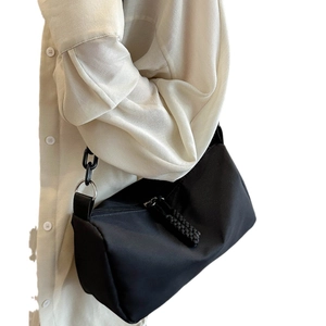 Minimalist black nylon crossbody bag with chunky silver chain and large capacity