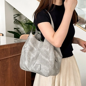 Retro grey large capacity tote bag with multiple compartments shown on model for daily commute