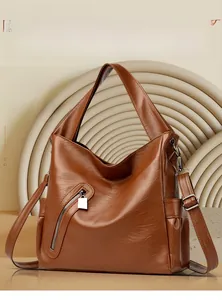 Brown soft leather tote bag showing detailed texture and front zipper pocket design