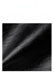 Detailed macro shot of durable black litchi grain leather texture with matte finish