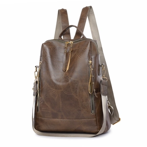 Brown vintage faux leather backpack with textured marble pattern and gold metal zippers