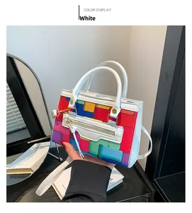Detail of white mini bag with colorful geometric print and round double handles