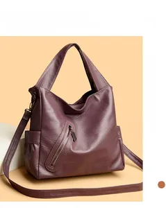Detail of soft purple PU leather tote with zipper pocket and wide shoulder strap