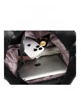 Macro view of large tote bag interior showing spacious compartments and zip pocket