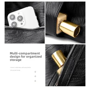 Detail of leather tote bag showing multiple internal compartments for storage organization