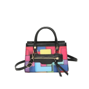 Chic multi-color geometric block crossbody bag with gold zippers and black leather trim