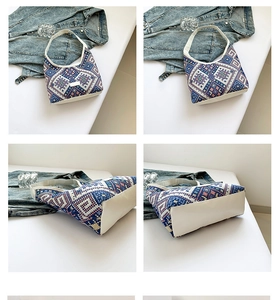 Detail view showing ethnic geometric jacquard fabric and white leather trim on hobo bag