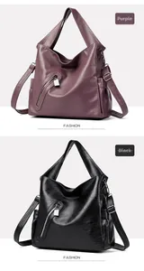 Detail of large soft leather tote bags in purple and black with diagonal zippers