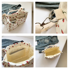 Vue détaillée du sac fourre-tout en velours à fraises avec crochets et structure interne