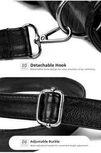Close-up of detachable gunmetal hooks and adjustable buckles on a black leather tote bag