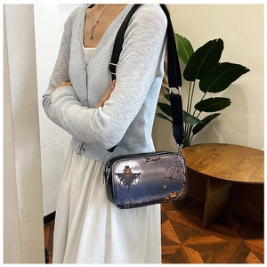 Fashionable Halloween print crossbody bag with wide strap worn on casual outfit
