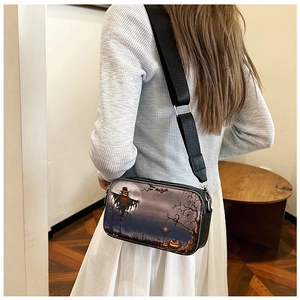 Detail of trendy Halloween crossbody bag with adjustable wide strap shown on model