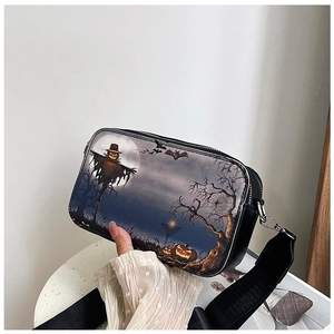 Detail of Halloween crossbody bag with scarecrow and pumpkin print and wide strap