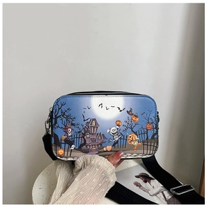 Detail of Halloween crossbody bag showing spooky castle print and wide nylon strap