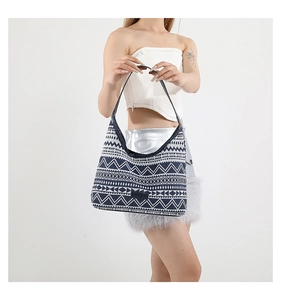 Detail of bohemian geometric canvas tote bag showing large capacity and blue fabric strap