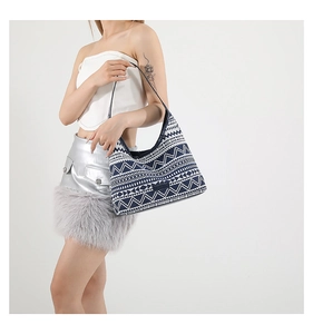 Detail of bohemian geometric patterns and 'FASHION' label on a navy blue canvas tote bag