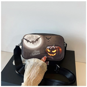 Close-up of Halloween square bag featuring pumpkin prints and wide shoulder strap