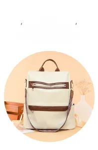 Close-up of beige PU leather backpack with geometric texture and ethnic woven strap