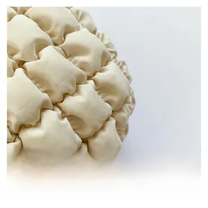 Close-up of off-white quilted bubble texture fabric on a stylish mini tote bag
