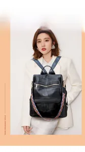 Close-up of black quilted PU leather backpack with colorful bohemian shoulder strap