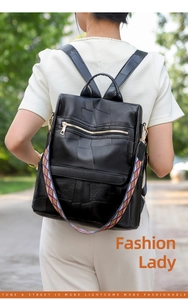 Detail of black PU leather backpack with colorful ethnic geometric woven strap