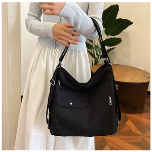 Schwarze Nylon-Tragetasche mit großer Kapazität, vielen Taschen und verstellbarem Gurt